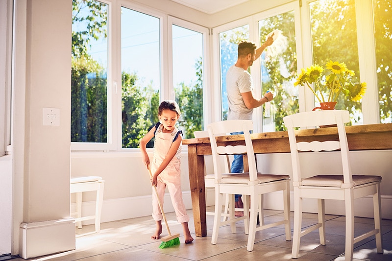 How Environmental Issues Can Affect Your AC - kid cleaning with dad.