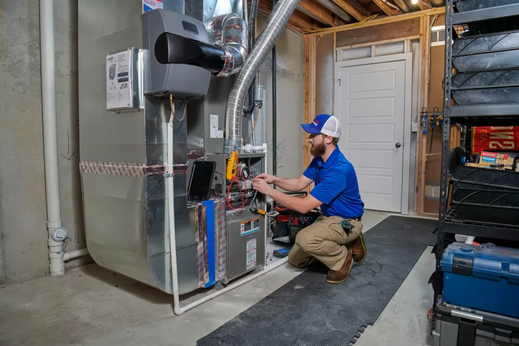 HVAC tech installing unit