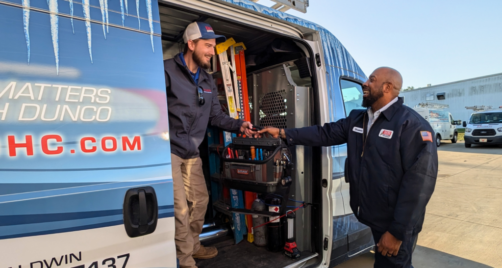 Dunco & Anthony HVAC Techs shaking hands