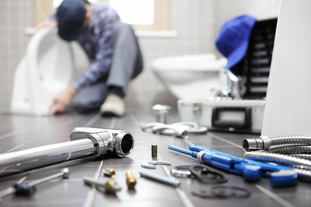 Image of a plumber. What Questions Should You Ask Before Hiring a Plumber?